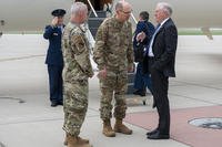 Gen. Duke Richardson, Air Force Materiel Command commander (middle), greets Secretary of the Air Force Frank Kendall on the flightline at Wright-Patterson Air Force Base, Ohio.