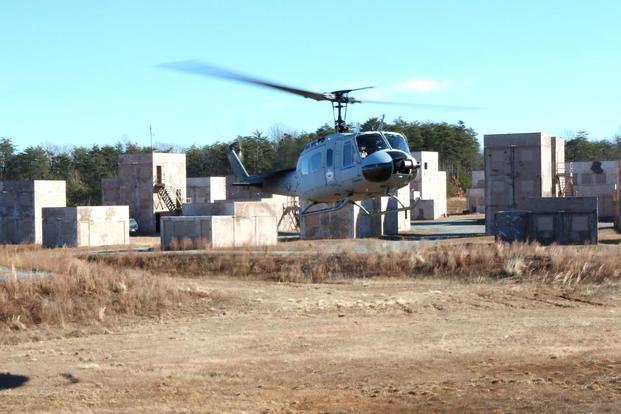 The Marine Corps demonstrated a new type of drone helicopter called the Autonomous Aerial Cargo/Utility System, or AACUS, on Dec. 13, 2017, at Quantico, Va. A backup pilot can be seen in the cockpit. (Military.com photo by Matthew Cox)