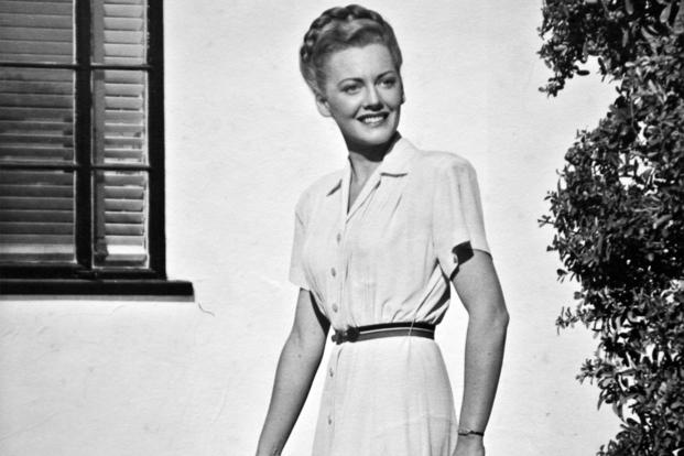 Betty Blake, 20 years old, stands in front of her family’s home in Honolulu, Hawaii. Blake worked at the captain of the Navy yard’s office and also flew tourists around the Hawaiian Islands as a commercial pilot before the attack on Pearl Harbor. (Courtesy photo)