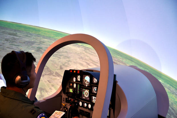 A student pilot enrolled in Undergraduate Remotely Piloted Aircraft Training at Joint Base San Antonio-Randolph, Texas, takes off in a new T-6 Texan II flight simulator on July 10. (US Air Force photo/Clinton Atkins)