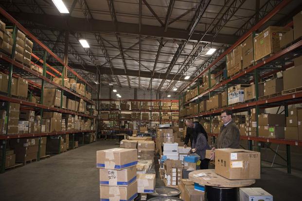  Three 30th Contracting Squadron civilians survey items Feb. 12, 2019, in a warehouse used for storing government property at Vandenberg Air Force Base, Calif. The team is responisble for saving $1 billion over the course of seven years. (U.S. Air Force photo by Airman 1st Class Hanah Abercrombie)