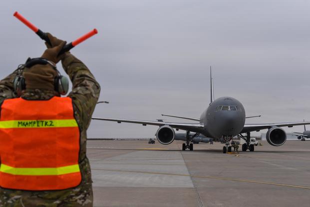 Master Sgt. John Grindstaff, 931st Air Refueling Wing crew chief, marshals a KC-46A Pegasus for its first familiarization flight from McConnell Feb. 26, 2019, at McConnell Air Force Base, Kan. (U.S. Air Force/Airman 1st Class Alexi Myrick)