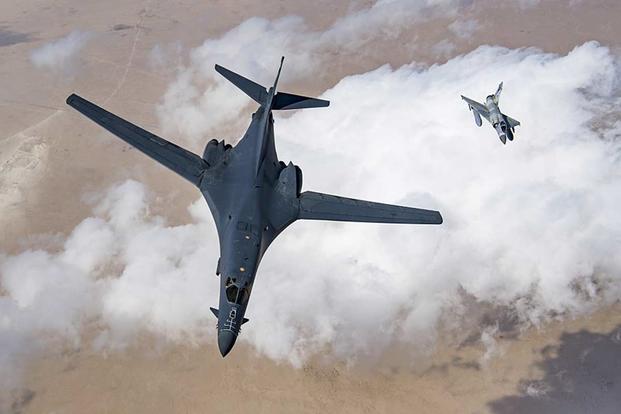A U.S. Air Force B-1B Lancer bomber and a Qatari Mirage 2000 fly in formation during Joint Air Defense Exercise 19-01 on Feb. 19, 2019, over Qatar. (U.S. Air Force photo by Staff Sgt. Clayton Cupit)