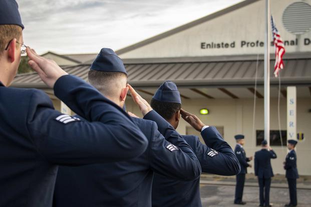 Lightning Flight airmen salute as the American flag is raised March 19, 2019, at Eglin Air Force Base, Fla. (U.S. Air Force photo/Samuel King Jr.)