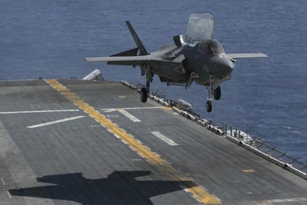 An F-35B Joint Strike Fighter executes a vertical landing on an amphibious ship. (Photo: Raytheon)