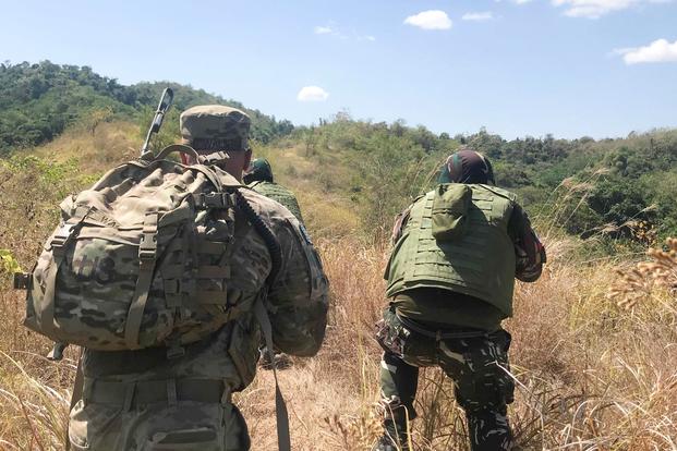 A soldier with the U.S. 5th Battalion, 20th Infantry Regiment, moves through mountainous terrain with his Armed Forces of the Philippines counterpart March 6, 2019, at Nueva Ecija Province, Philippines, during Exercise Salaknib. Salaknib builds expeditionary readiness at multiple echelons by deploying task-organized forces to consecutive locations where they conduct training operations upon arrival. (Photo courtesy of U.S. Army)