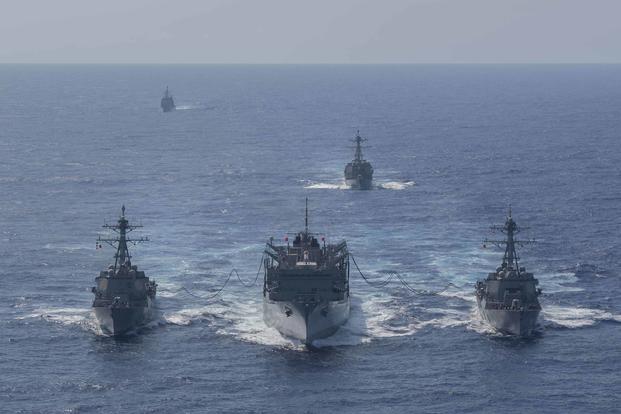 From left to right, the guided-missile destroyer Forrest Sherman (DDG 98), the fast combat support ship USNS Supply (T-AOE 6), and the guided-missile destroyer Gravely (DDG 107) conduct a refueling-at sea, while the guided-missile cruiser Normandy (CG 60) (far left) and guided-missile destroyer Winston S. Churchill (DDG 81) (center right) stand-by in the Atlantic Ocean onSept. 7, 2019. (U.S. Navy photo by Mass Communication Specialist 3rd Class Rebekah M. Rinckey)