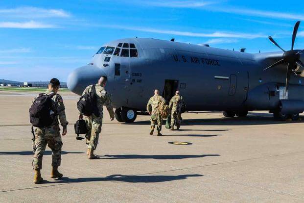 Soldiers from the 531st Hospital Center and 586th Field Hospital board a transport aircraft headed for New York.