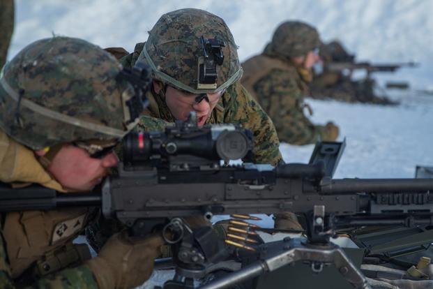A Marine conducts an ammo count during a machine gun live-fire range in Norway.