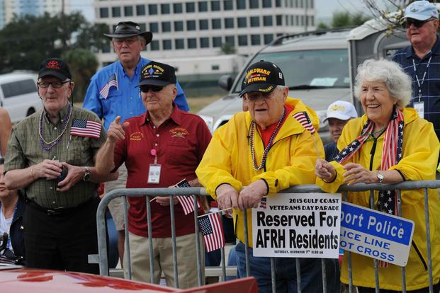 Armed Forces Retirement Home residents watch the 2015 Gulf Coast Veterans Day Parade in Gulfport.