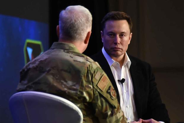Elon Musk speaks with U.S. Air Force Lt. Gen. John Thompson during a Q&A.