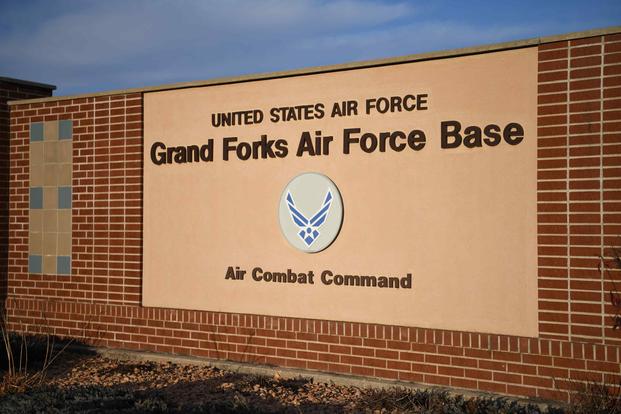 An installation sign is displayed at the main gate of Grand Forks Air Force Base, North Dakota.