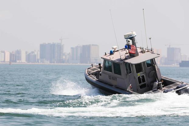 Sailors pursue a Bahraini Coast Guard security boat during exercise Neon Defender 19, Sept. 16, 2019. 