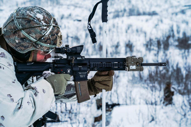 Marine fires M27 infantry automatic rifle Setermoen, Norway