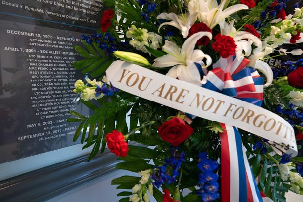 A wreath is laid near the names of the U.S. and Vietnamese service members of the MI-17 Tragedy.