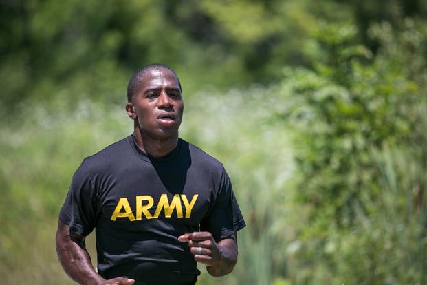 Army sergeant nears finish line of run.