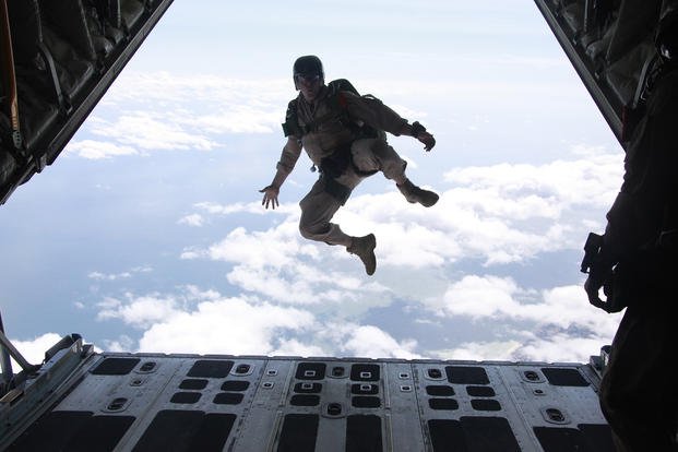 MARSOC Marine jumps out of a refueler squadron aircraft.