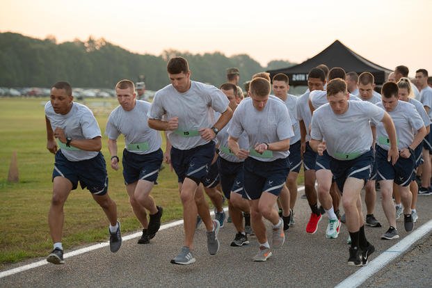 Officer Training School trainees run during an Air Force physical fitness test.