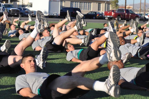 Soldiers perform flutter kicks at Fort Bliss.