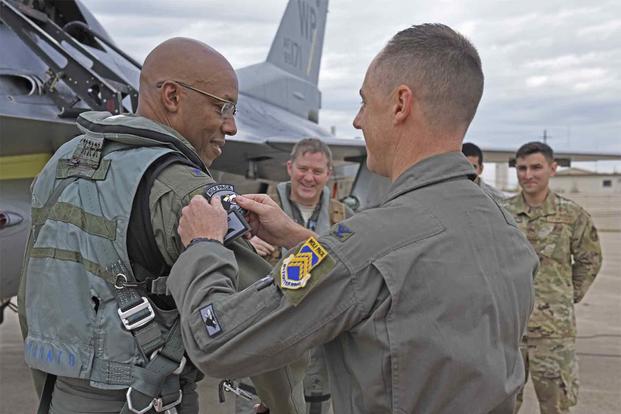 U.S. Air Force Gen. CQ Brown, Jr. receives a Wolf Pack patch