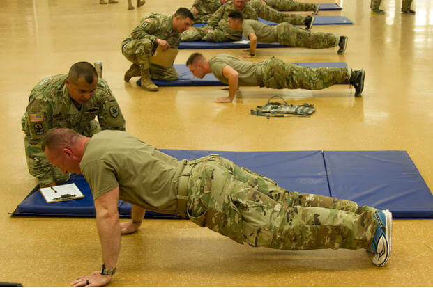 Soldiers from throughout the state of Arizona carry out the push-up portion of the Army physical fitness test during the Arizona National Guard Best Warrior Competition 2019.