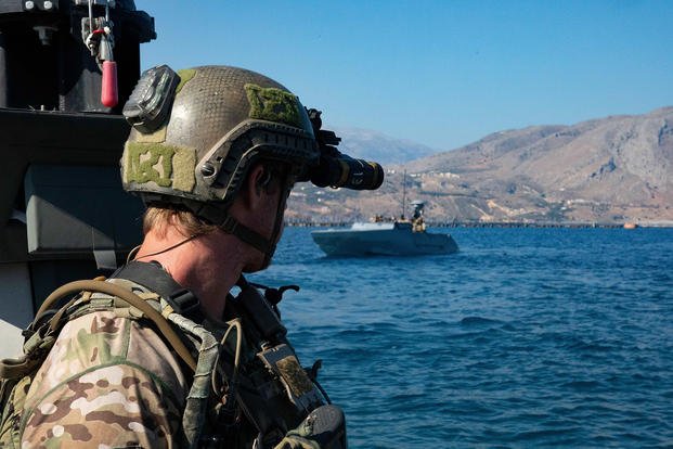 Naval Special Warfare Operators prepare for a training exercise.