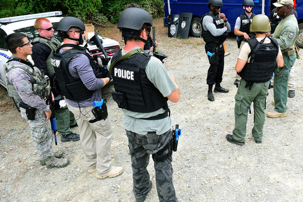Students are instructed on the basic SWAT course.