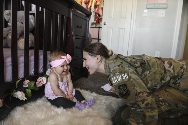 Senior Airman Cierra Benak, an aviation resource manager for the 437th Operations Support Squadron, plays with her daughter Charlotte at their home in Charleston, S.C.