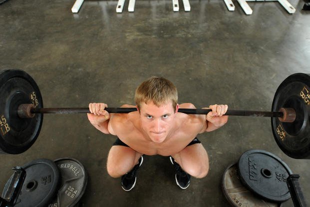 A National Guardsman displays his form in the squat.