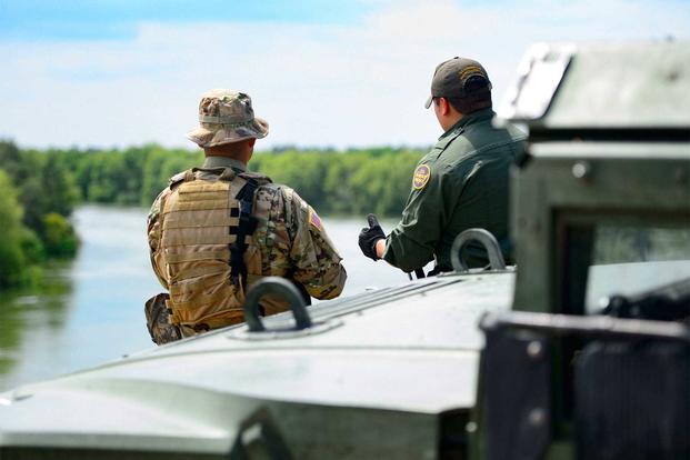 A Texas Guardsman and a Customs and a Border Patrol agent.