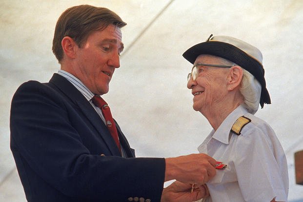 Adm. Grace Hopper is honored by Navy Secretary John Lehman during her retirement ceremony aboard the USS Constitution.