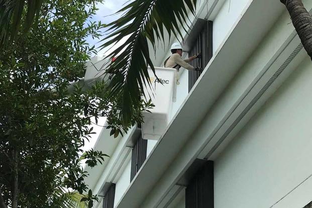 Electrician shutters the barracks on Naval Air Station Key West.