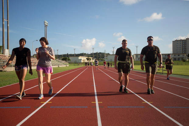 Participants make their way around the track during the Walk for Survivors Walk-A-Thon aboard Camp Foster, Okinawa, Japan.