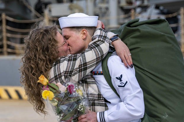 A sailor, assigned to the Arleigh Burke-class destroyer USS Gonzalez (DDG 66), embraces their partner upon returning to Naval Station Norfolk after a regularly scheduled deployment in the U.S. 5th Fleet and U.S. 6th Fleet areas of operations.
