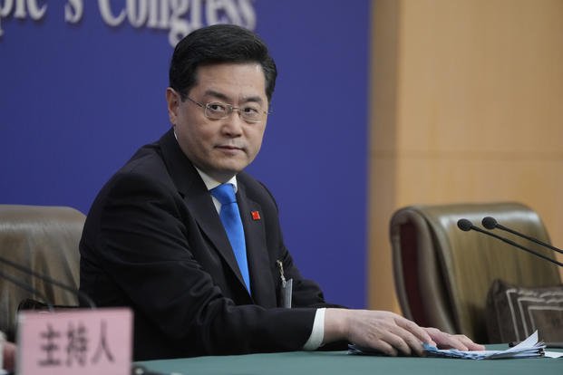 Chinese Foreign Minister Qin Gang looks on during a press conference