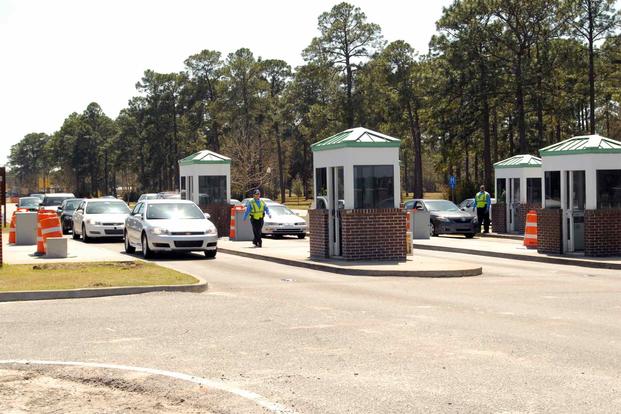 Cars pass through the checkpoint at Gate 1 at Fort Stewart, Georgia.