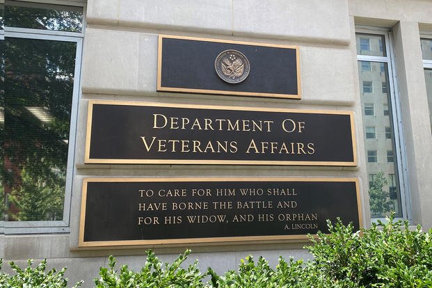 The Department of Veterans Affairs announced in March that it adapted a new motto that better reflects the nation's veterans and will be replacing the old motto at VA facilities. Removal of signs and permanent etchings on buildings, however, has yet to begin, as seen at VA headquarters on July 26, 2023. 