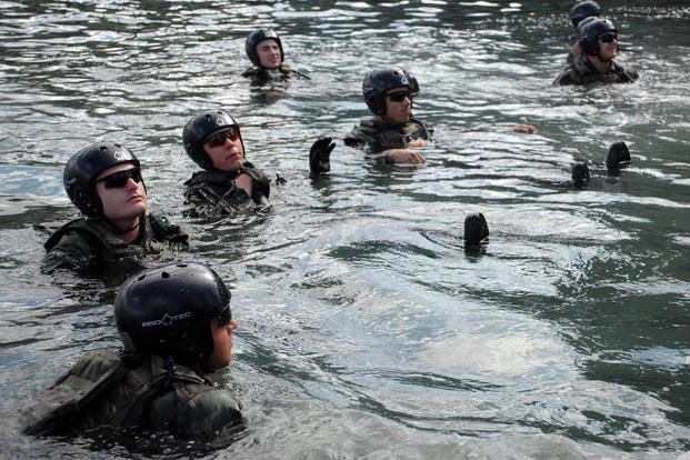Special Warfare Combatant-craft Crewmen candidates check their floatation devices before going to sea in Coronado, Calif. 