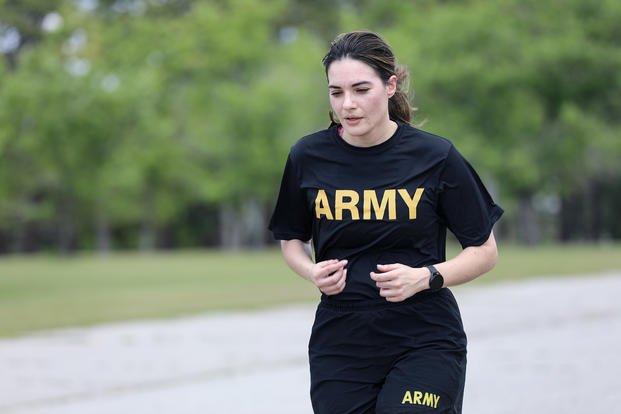 Cpt. Samantha Dimauro runs the 2-mile event of the Army Combat Fitness Test at Darby Field on Fort Jackson, South Carolina.