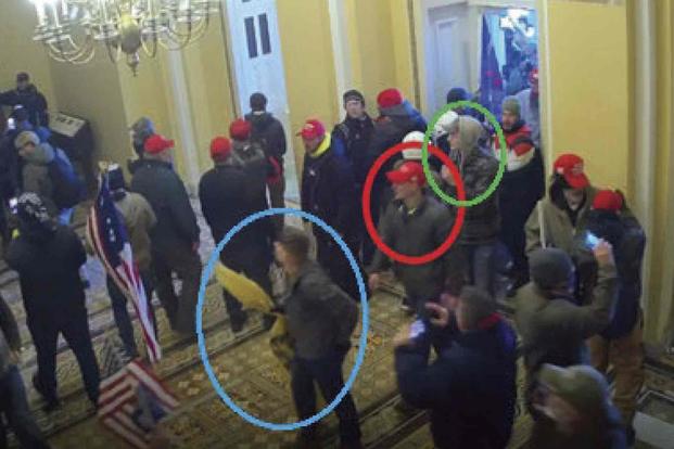 Dodge Dale Hellonen, circled in blue, appears inside the U.S. Capitol on Jan. 6, 2021, in Washington