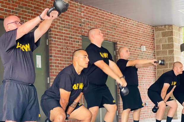 Soldiers in the Army's Future Soldier Prepatory Course's fitness track conduct afternoon physical fitness training with light kettlebells. 