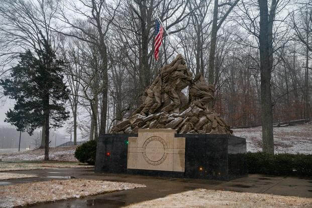 Snow falls at the Iwo Jima memorial statue by the front gate at Marine Corps Base Quantico, Virginia, Jan. 28, 2022.