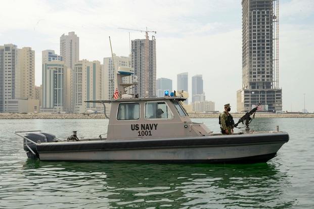 A harbor security boat patrols the waterway near the Mina Salman pier onboard Naval Support Activity (NSA) Bahrain.
