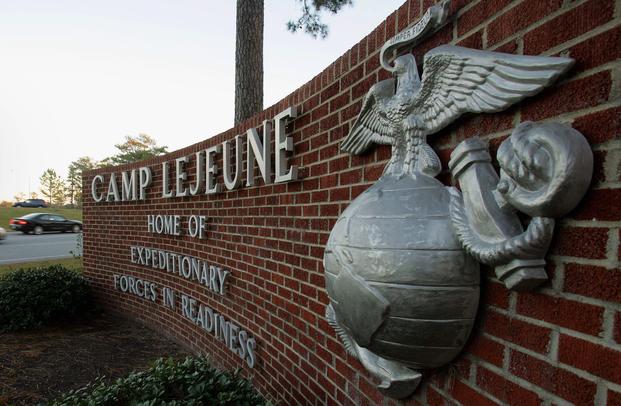 This Dec. 2, 2005 file photo shows cars entering the main gate at Camp Lejeune in Jacksonville, N.C.