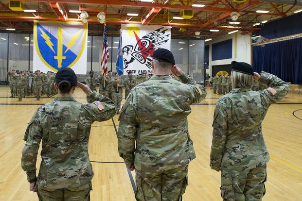 Members of the 109th Expeditionary Military Intelligence Battalion conduct a change of command ceremony in 2019.