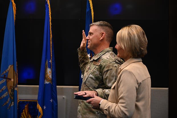 Newly promoted Brig. Gen. Brian R. Moore, Oklahoma City Air Logistics Complex commander, receives the oath of office at Tinker Air Force Base, Okla.