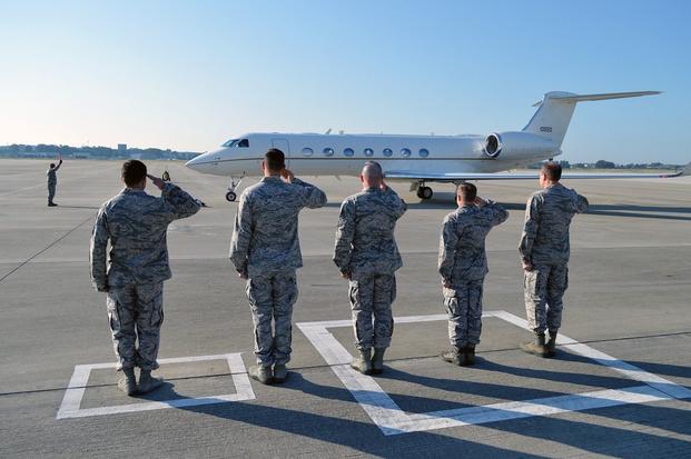 Pope Airfield senior leaders salute Secretary of the Air Force Deborah Lee James aircraft during her arrival to Pope Army Airfield, N.C., May 19. 