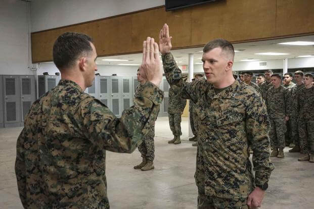 United States Marine is pinned to the rank of Captain