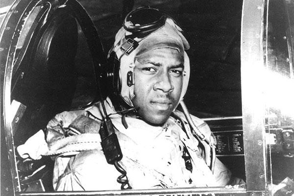 Ensign Jesse L. Brown, USN In the cockpit of an F4U-4 Corsair fighter, circa 1950. He was the first African-American Naval Aviator to see combat. Brown was shot down over North Korea. (National Archives)