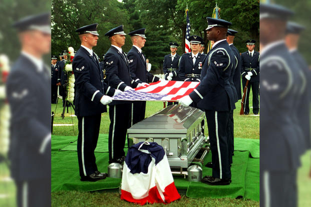 Members of the Air Force Honor Guard prepare to fold the flag during funeral services honoring U.S. Air Force 1st Lt. Michael Blassie on July 11, 1998, at Jefferson Barracks National Cemetery, south of St. Louis, Mo. (Photo: U.S. Air Force)